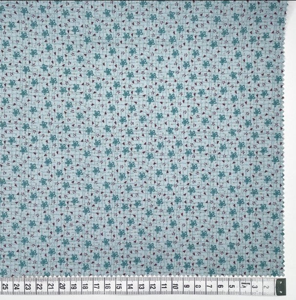 Botanicals 80990-114 - light blue cotton fabric with blue daisies and tiny red hearts scattered over