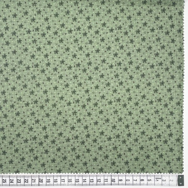 Botanicals 80990-115 - light green cotton fabric with green daisies and tiny red hearts scattered over