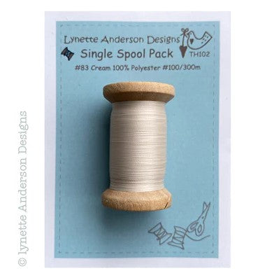 Cream Polyester Thread on a wooden spool