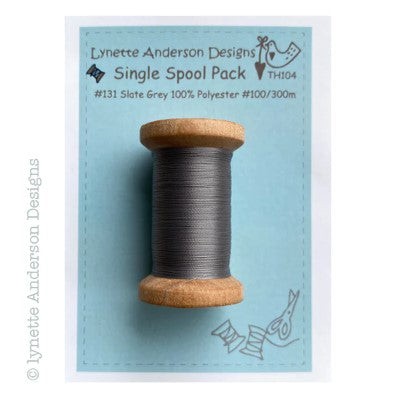 Gray Polyester Thread on a wooden spool