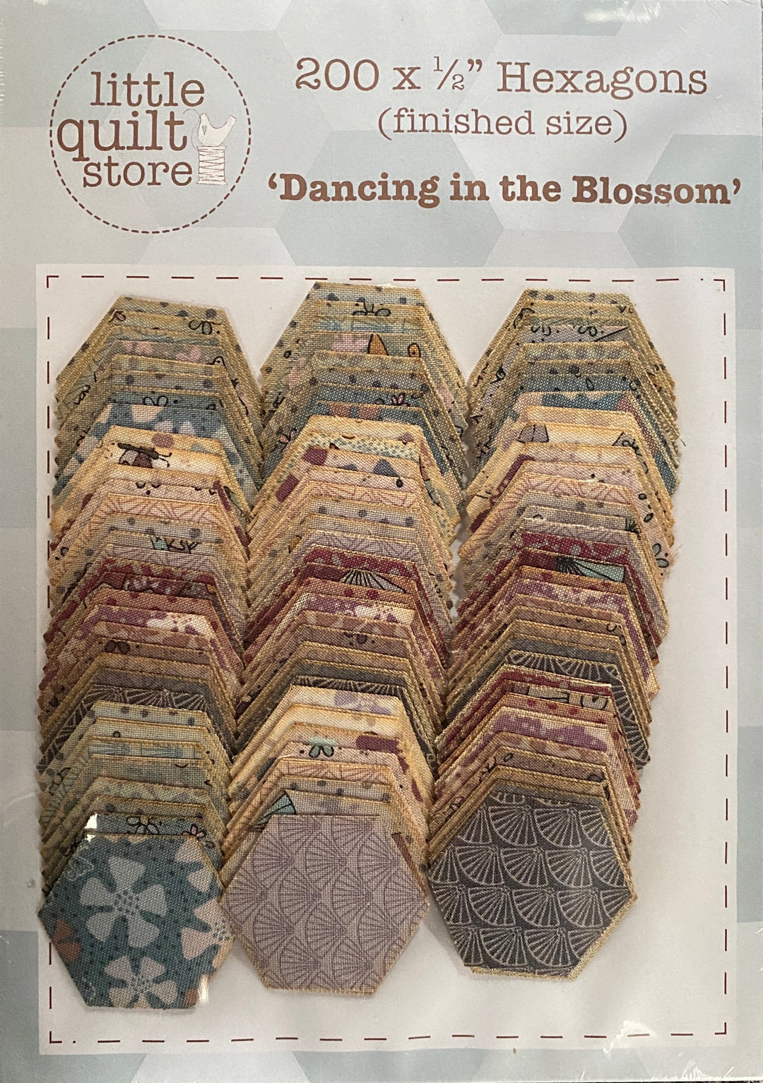 100 x 1/2" (finished size) laser cut fabric hexagons of Dancing in the Blossom cotton fabric 